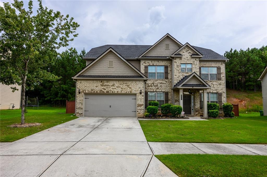 This exquisite 5-bedroom home is an entertainer's dream, nestled on a quiet subdivision. The dramatic wide foyer opens to an elegant, open floor plan featuring soaring ceilings and pristine hardwood floors. The extraordinary kitchen is the heart of the home, complete with cabinetry, marble countertops, stainless steel appliances. The main level includes a private home office and or coveted first-floor guest suite with a full bathroom. Upstairs, the luxurious primary suite offers a true sanctuary with vaulted ceilings, a walk-in closet, and a spa-like bath featuring a soaking tub and a large shower. Four additional bedrooms, each with ample closet space, and a well-appointed laundry room complete the upper level. Outside, the professionally landscaped back yard provides a serene escape with a large gazebo on the patio, perfect for summer barbecues and family gatherings.