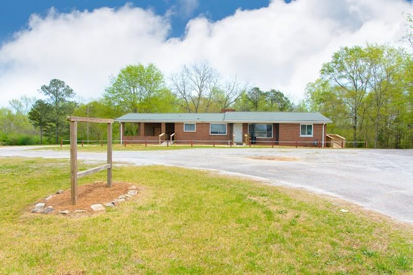 Commercial Property in Carrollton!! Don't miss out on this low-maintenance brick building, approx 3287 sq ft, situated on +/- 3 acres. The high-traffic location on Hwy 27 S is across from Sunsouth John Deere and next door to AgSouth Farm Credit. The upper level of the building has a lobby, conference room, kitchen, multiple offices, plus men's and women's restrooms. The lower level has offices, a restroom, and a private entrance giving this space the perfect opportunity for an additional business. This site has a parking lot and will accommodate your parking needs. The storage building is a bonus. You will find an abundance of options with this property. Schedule your appointment today!