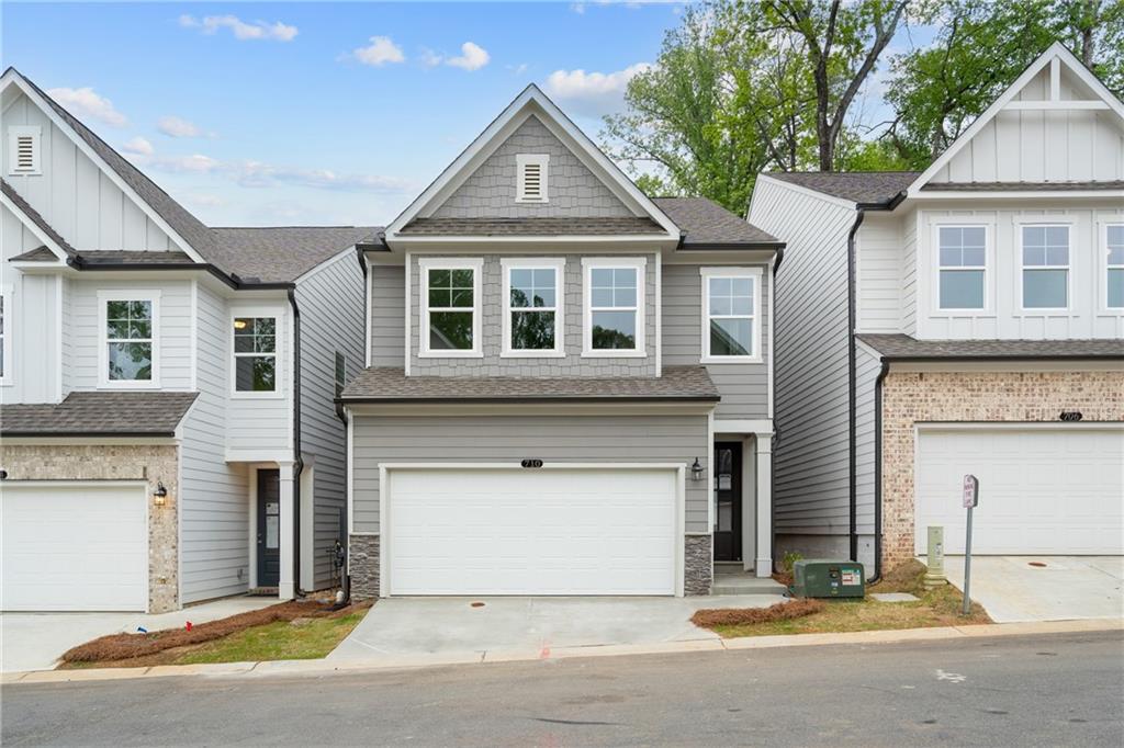 READY NOW!!! Welcome to The Marion B lot 66, a stunning 3-bedroom, 2.5-bath residence in the sought-after GATED Village at Shallowford just steps from pool and clubhouse. This move-in-ready home spans 2,008 sqft, combining elegance with practicality. The open layout invites you into a bright foyer leading to a gourmet kitchen with a large island, 42” cabinets, gleaming Quartz countertops, and top-of-the-line stainless-steel appliances.
Relax in the cozy living room, complete with a charming shiplap fireplace and 9 FT ceilings throughout the main level, or entertain guests in the adjoining dining room with easy access to the private patio. Retreat to the oversized primary suite, offering a luxurious extended tile shower and a walk-in closet, providing a peaceful escape from the secondary bedrooms.
Enjoy the open railing staircase that adds a feeling of light and spaciousness and oak treads on the stairs enhance the sophisticated ambiance. Set within the ONLY gated community with a pool and clubhouse in Kennesaw, enjoy quality amenities and proximity to excellent schools. With its charming exteriors and open floor plans, this home is a true gem.
Self-guided tours available!
