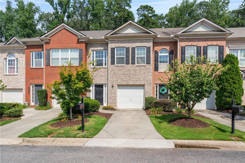 Gated Community and low-maintenance living in townhome located in Hearthstone Subdivision.The home has been freshly painted throughout. Spacious first floor featuring laminate flooring and large living/dining area.. Just short drive to Avalon, Halcyon and many free events every weekend at Cumming City Center in season, this home combines a great location and a great school system. Experience effortless, low maintenance living in heart of Cumming. Market Place Blvd is less than two miles for all your shopping needs. All City Services around the corner as well. The 3rd floor provides a Great teen or in law suite, complete with a living area, bedroom and full bath. New roof 2024.