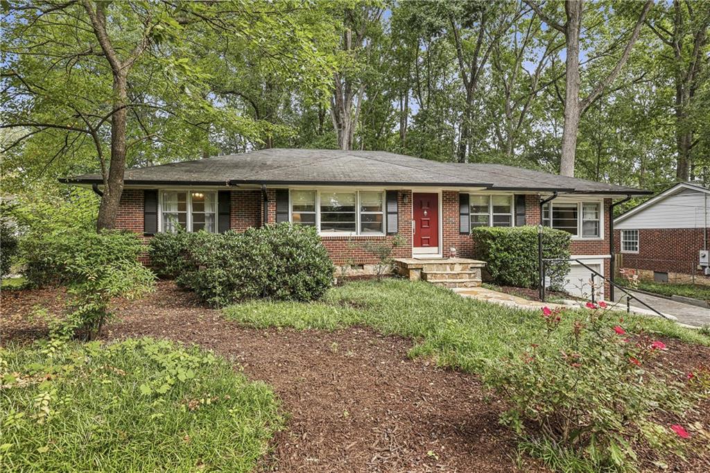 The most perfect home in sought after Leafmore Hills is here! Welcome home to this beautiful 3 bedroom, 2 bathroom all brick ranch with basement. This home has been updated while maintaining its original charm and character. On the main level, you will find three large bedrooms including a gorgeous updated primary bedroom and bathroom. Hardwood floors run throughout the home. The kitchen has been fully updated with a movable island and a great view to your dining room, living room and bonus room. In the basement, you will find the vibiest hang out room, tons of storage, another option for an office and an entry way out to the stunning turfed backyard with a storage shed that has water and electric hook ups. The double deck has two separate areas-one area for eating and a private nook for a spa or game area. The home is situated on a beautiful wooded lot and located minutes from great shopping and restaurants, Toco Hills Shopping Center, Mason Mill Park, Emory University and Hospital, Leafmore Pool, Briarcliff Woods Beach Club, Echo Ridge Recreation Club, City of Decatur shops and restaurants, and so much more. The location cannot get better than this!