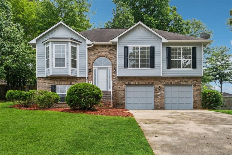 Welcome to 12290 Greenmont Walk, a spacious split-level home in a prime Alpharetta location. With 4 bedrooms, 3 full bathrooms, and flexible living areas across two levels, this home offers plenty of room to spread out and make it your own.

Upstairs, you'll find a bright living area with refinished hardwood floors, fresh paint, and a functional flow from the dining space to the kitchen and breakfast nook. Step out onto the new deck—perfect for enjoying peaceful mornings or winding down in the evening. The primary suite includes a walk-in closet and en suite bath, while two additional bedrooms and another full bath complete the upper level.

Downstairs, a versatile second living space awaits—ideal for a media room, office, or guest retreat—alongside a fourth bedroom, full bath, laundry, and a large utility area off the garage ready for storage or a workshop setup.

With 1,606 square feet upstairs and an additional 624 downstairs, this home offers flexibility in a location that’s hard to beat—just minutes from Avalon, downtown Alpharetta, and Wills Park.