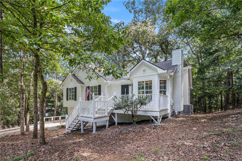 Stunning remodeled raised ranch on a spacious 0.68-acre lot near scenic Lake Allatoona! This move-in-ready home boasts a new architectural shingle roof with ridge vents, fresh interior/exterior paint, modern flooring, and a gourmet kitchen with quartz countertops and stainless-steel appliances. Enjoy new HVAC units, a 40-gallon gas water heater, updated bathrooms, and stylish light fixtures. The basement features two finished rooms and epoxy flooring, matching the sleek garage with new door openers, remotes, and keypad. Relax by the fireplace or on the newly stained front and back decks. Recent upgrades include a cleaned/inspected septic tank, professionally cleaned air ducts, and a 5-year termite treatment (paid). Nestled in a quiet, no-HOA neighborhood, this home offers modern comfort and serene living. Don’t miss out!
