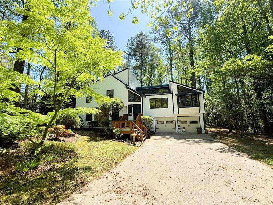 This spacious and thoughtfully designed 4-bedroom, 3-bath residence in Pope HS district , with a full in-law suite, is located in one of Marietta’s most desirable neighborhoods, within the boundaries of East Cobb’s top-rated schools. Offering a seamless blend of comfort, functionality, and tranquility, this home is ideal for modern living.

Positioned on a leveled lot, the home welcomes you with an open floor plan, gleaming hardwood floors, and abundant natural light throughout. The inviting family room features a charming fireplace, creating a warm and cozy atmosphere, perfect for relaxing evenings or entertaining guests.

The well-appointed kitchen boasts stainless steel appliances and flows effortlessly into the dining area, making it ideal for both daily living and hosting. There’s also space to add an island, providing additional prep space and casual dining options.

The spacious primary suite serves as a private retreat, complete with a beautifully updated en-suite bath that combines contemporary style with everyday convenience.

A fully finished basement with a kitchen to be used as the perfect guest unit ot the ideal bar.  Both the interior and exterior accesses add exceptional flexibility. With its private entry to the backyard, this versatile space can be used as a guest suite, recreation room, home gym, or additional living area.

Step outside into your very own backyard oasis. The expansive yard features a large deck and plenty of open green space—a peaceful, nature-filled setting perfect for gardening, playing, or simply taking a break.

Additional Highlights:

Long driveway with parking for up to four cars
True two-car garage
Access to nationally ranked schools
Close to  shopping, dining, and recreational amenities
Whether you’re hosting guests, working from home, or enjoying a quiet evening under the stars, this home offers the perfect blend of luxury and livability.

Don’t miss your chance to own this East Cobb gem—schedule your private tour today!