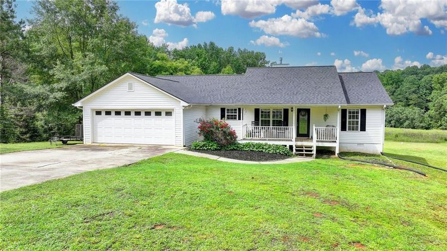 Country Living at its Best!  Just under 8 private acres in newly remodeled 3 Bedroom/2 Bath.  Convenient to both Gwinnett and Hall Counties but without their tax's.  Home located at the end of a very quite street with virtually no sight of neighbors.    You want Peace and Privacy, this is the home!