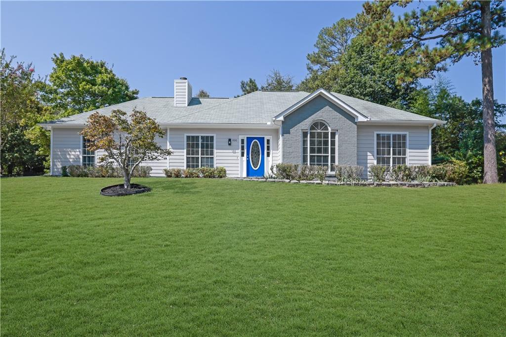Charming 3BR/2BA ranch on a spacious corner lot in Westmill Creek. The inviting family room with fireplace opens to the dining area and kitchen featuring granite countertops and classic cabinetry. Fresh paint, updated flooring, and modern fixtures throughout. A beautiful sunroom with abundant natural light overlooks the backyard—perfect for relaxing or entertaining. Primary suite with private bath plus two secondary bedrooms and full hall bath. Large fenced yard, two-car garage, and convenient Marietta location near shopping, dining, schools, and major highways. Full of charm and move-in ready—make this property your home!