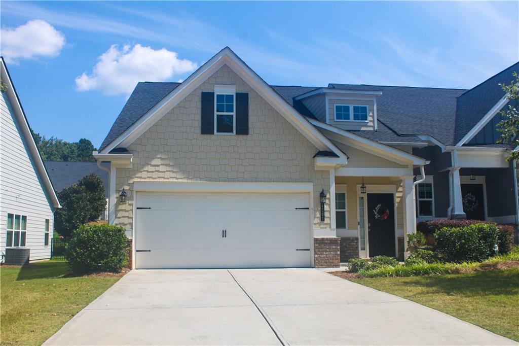This charming end-unit townhome offers a spacious and functional open floorplan designed for comfortable living. The main level features the master suite along with a secondary bedroom and full bath, while the upper level includes a versatile loft, an additional bedroom, and another full bath, ideal for guests or a home office. Expansive windows across the back of the home fill the living areas with natural light. The kitchen is appointed with white cabinetry, stone countertops, stainless steel appliances, and a refrigerator that remains with the property. Main floor laundry room with washer and dryer included provides added convenience, and the screened porch offers a relaxing outdoor retreat. Situated in a highly desirable location, the home is just minutes from shopping, dining, KSU, and the historic charm of Downtown Acworth, Downtown Kennesaw, Woodstock, and Marietta Square. This low-maintenance residence is move-in ready and available for a quick close.