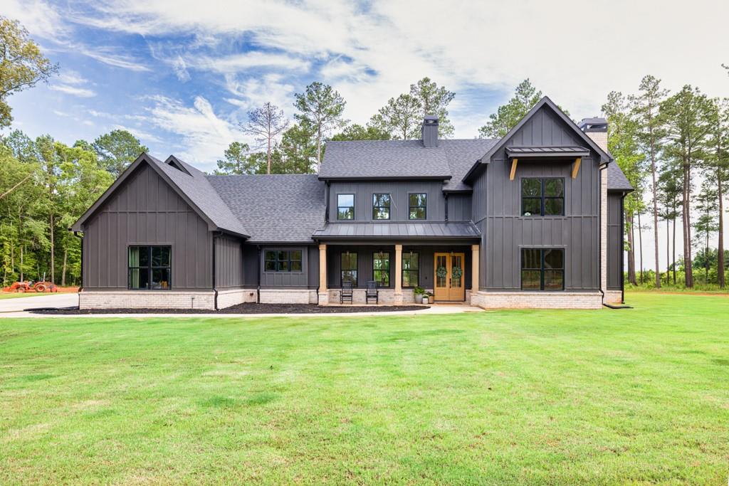 Welcome to 270 Indian Creek, located in Good Hope Georgia. This home offers everything you could want in a modern farmhouse. The first feature you will notice as you step in the double front doors will be the never ending ceilings and the stone fireplace that runs from floor to ceiling! This home has been intentionally crafted with custom touches all throughout the home that add character and texture to every room. From the grand living room you will enter the kitchen with a massive island that is covered in beautiful quartz counter tops with all stainless steel Thermador appliances. The master bedroom is on the main with a bathroom that has a walk-in shower and free standing tub, that will help you wind down after a long day. It sits comfortably on approximately 32 acres and has a beautiful creek that runs along the middle of the property. It is truly a serene retreat that is still conveniently located to the Monroe and Athens area. Whether your looking for a farm or just a beautiful place to live this property checks all the boxes! Come see for yourself!