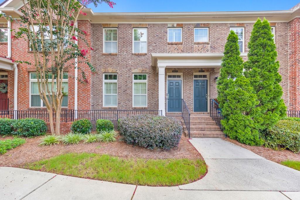 Experience refined townhome living in the heart of Johns Creek! This beautifully maintained 2 bed / 3.5 bath townhome is nestled in the highly sought-after gated Abberley Towneship swim/tennis community, just steps from the brand-new Morton Road Park and located in a top-rated school district. Hardwood floors, crown molding, and recessed lighting welcome you into the spacious main level, which features a separate dining room and an updated kitchen with a center island, stone countertops, stainless steel appliances, and a sunlit breakfast nook. The fireside family room offers built-in bookshelves and opens to a bright flex space perfect for a home office or reading room. A private rear deck is ideal for relaxing or entertaining, and a half bath completes the main level. Upstairs, the oversized primary suite impresses with tray ceilings, a large walk-in closet, and a spa-like ensuite with double vanities, a whirlpool tub, and a separate shower. A secondary bedroom with its own private ensuite bath and walk-in closet, plus a conveniently located laundry closet, round out the upper level. The finished terrace level offers a large bonus room ideal for a media room, playroom, or potential third bedroom, along with a full bathroom and access to the attached 2-car garage. Enjoy the peace of mind and amenities of a gated community with a pool and tennis courts, all just minutes to Avalon, Downtown Alpharetta, GA-400, Ocee Park, Newtown Park, and fantastic shopping and dining options. This one checks all the boxes—don’t miss it!