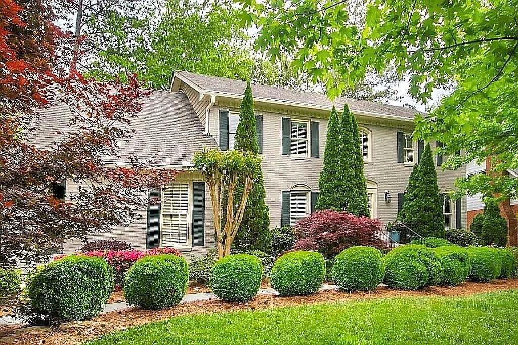 This well maintained home in Peachtree Forest offers a serene backyard overlooking a peaceful lake, complete with a deck, custom stone fireplace, and stone benches. As you step into the two-story foyer with its elegant chandelier, you'll be greeted by a seamless flow from the formal living and dining areas to the updated kitchen featuring white cabinets, stone countertops, and an island. The sunroom, adorned with custom stained glass windows, provides a picturesque view of the lake and backyard. The two-story great room boasts a wet bar, stone fireplace, built-in bookshelves, and a staircase leading to the second level. Upstairs, you'll find four bedrooms and three baths. The master bathroom features a beautifully tiled shower and bath combination. The finished basement includes a bedroom, full bath, meditation room, and media room. Hardwood floors grace the main level, adding to the home's charm and warmth. Don't miss out on this exceptional rental opportunity.