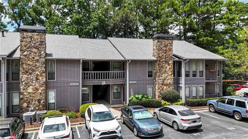 Welcome home to this beautifully maintained 2-bedroom, 2-bathroom condo featuring a spacious master suite on the main level and gleaming hardwood floors throughout. Nestled in a secure, gated community, this ground-floor unit offers a private rear entry and a layout designed for comfort, convenience, and modern living. Enjoy access to resort-style amenities including a swimming pool, tennis courts, and well-lit community streets—all maintained by a professional homeowners association. Safety and peace of mind come standard with features such as a security system (owned), carbon monoxide detectors, smoke detectors, and a community security gate. Ideally located just minutes from downtown, with quick access to major interstates, this home is near schools and public transportation, making it perfect for commuters or anyone seeking a vibrant, connected lifestyle. Don’t miss this opportunity to own a low-maintenance, move-in-ready condo in a sought-after, amenity-rich neighborhood!