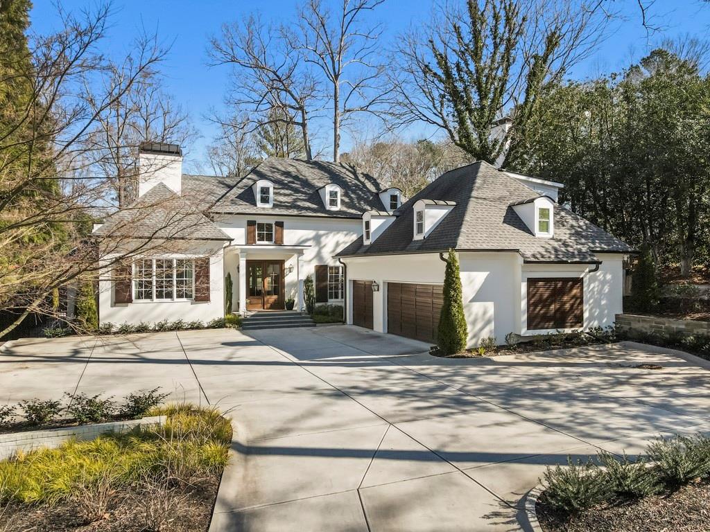Spectacular transitional California style home in the heart of Tuxedo Park. Fully renovated in 2017 with the addition of a stunning 3-story pool house completed in 2019. This gorgeous estate lot has everything the discerning buyer is looking for. Beginning with a two story entryway with sweeping views of the pool and flat walk out backyard with beautifully manicured landscaping. The main level has bright open spaces that are flooded with natural light and perfect for entertaining. The thoughtfully renovated chef’s kitchen boasts oversized island, custom cabinetry, Viking appliances, walk-in pantry, and more. The butler’s pantry has under counter wine fridge and Scotsman ice maker and leads to an elegant dining room perfect for intimate gatherings. Master on the main features a spa-like shower, double vanity, and large walk-in closet. Four additional bedrooms upstairs all with en-suite bathrooms and additional laundry room. The backyard is a true showstopper with large saltwater pool and the incredible addition of a pool house. The pool house offers a separate living and/or entertaining space with 1 full bedroom and 2 full bathrooms. The main level features a full size kitchen with Lynx grill, wolf oven, subzero fridge, ice maker, and wine cooler, a large living room overlooks the pool and gardens, and full size bathroom. The second level has a spacious bedroom and full bath with walk-in closet. The lower level is a full sized heated and cooled batting cage that could also transform into an exercise room or wine cellar. There is an additional bedroom and full bathroom above the 3-car garage perfect for a nanny or au pair suite. Total smart home with control 4 system and in ceiling speakers in main home and pool house.