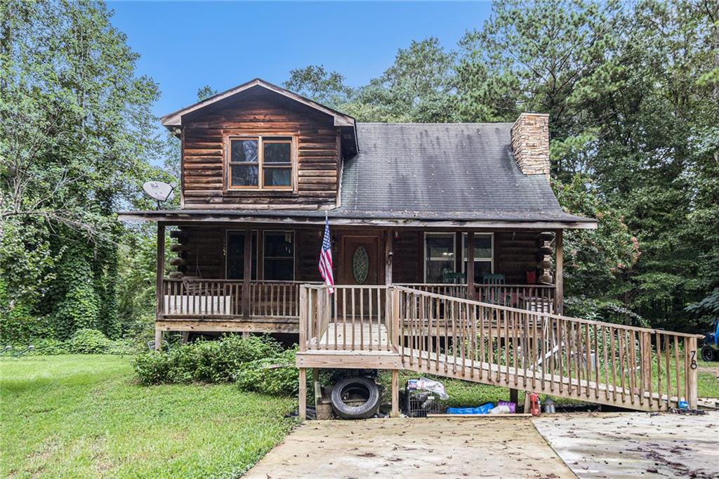 Your Chance to own a Custom Cyprus log home w/ 4 BR & 4.5 BA conveniently located in Tallapoosa. Accessible bedroom and bath on main floor. Ramp entry from easy to navigate concrete drive to a full length covered front porch. Great for a family with a loved one with mobility challenges. This cabin is built with Cypress logs, Cypress is exceptionally stable, more resistant to splitting and warping and has a natural resistance to insect infestation. Step into the too story entry with open beams and beautiful wood cathedral ceiling. A Large gas log fireplace catches the eye immediately upon entering. .Each bedroom has its own bathroom and walk-in closet. Downstairs master was recently redone with a walk-in tub(The 2nd master has an antique 1940’s footed tub.) The other downstairs bath has been redone as well. It also has a large bonus loft room that makes an excellent office/playroom or 5th bedroom. Open floor plan with living room, dining room and kitchen. The kitchen has stainless steel appliances recently updated. Separate Laundry/mud room with half bath. It sits atop a full poured concrete basement with roll up entry and walk in entry. Partially finished basement with a workshop. New water heater & faucets in upstairs master & kitchen
New concrete drive
Front porch, back deck, Beautiful creek and Koi Pond for quiet relaxation
City water, sewer and gas without city taxes.
Halfway between Atlanta and Birmingham and Chattanooga and Columbus
Within walking distance of Dub Denman canoe trail on the Tallapoosa River
This property would be great for a family with a child or aging parents with mobility needs. It would also make a profitable AirBNB