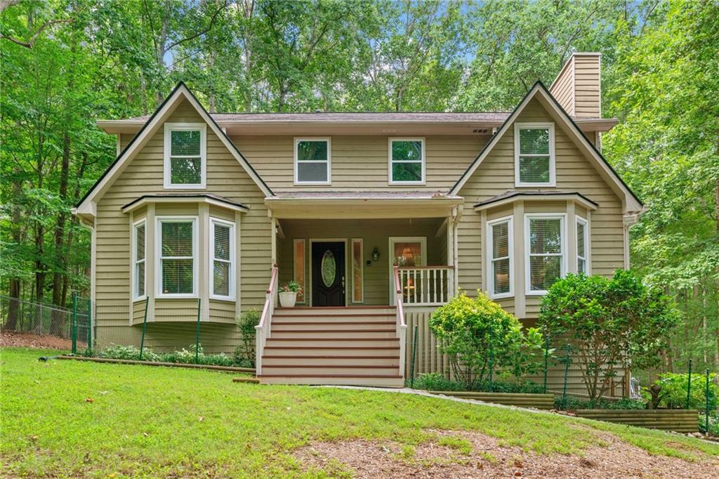 Private Retreat minutes from downtown Woodstock – 4BR, 3.5BA on 1.1 Acres
Tucked away on a beautifully wooded 1.1-acre lot, this meticulously maintained home offers the perfect blend of nature, comfort, and convenience. With two spacious primary suites—one on the main level and another upstairs—this home is ideal for multi-generational living or flexible guest accommodations.
Step inside and feel right at home in the warm, inviting living spaces. Enjoy your morning coffee or unwind in the evening from the serenity of your screened-in sunroom or beautiful back deck, both overlooking peaceful, tree-filled surroundings. A brand-new roof and careful upkeep throughout make this home truly move-in ready.
Love to work from home? You'll find dedicated office space ready to inspire productivity. Need a workshop? We’ve got that too—perfect for hobbies, storage, or creative projects.
Located just minutes from vibrant Woodstock, you'll enjoy quick access to top-rated schools, shopping, dining, and Lake Allatoona for weekend escapes. An adjacent 1.1-acre lot is also available, offering a rare opportunity to expand or preserve your own private sanctuary full of natural beauty and local wildlife.
This is more than a house—it’s a lifestyle. Schedule your private tour today and discover all this special property has to offer.