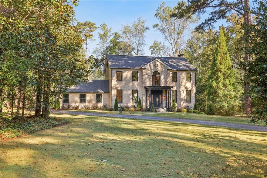 Located in Sandy Springs’ Heards Ferry Elementary School district, this fully renovated brick home offers a 1+ acre lot with a pool! The covered front entry opens to an inviting foyer and leads to a spacious main level featuring beautiful hardwood floors and an abundance of natural light. An elegant dining room with picture molding and a formal living room/office are located off the entry, setting the tone for this incredible home. The newly renovated kitchen impresses with an oversized Calacatta Alabaster quartz-topped island with seating, cabinetry extending to the ceiling, a counter-to-ceiling backsplash and a professional-grade range with a double oven, six burners, a griddle and a convenient pot filler. Enjoy extensive pull-out shelving for endless storage options as well as a beverage bar with a wine refrigerator and glass-front display cabinetry. A charming breakfast nook is tucked into a bay window, perfect for casual dining. The kitchen spills into the spacious family room, which boasts beautiful picture molding, a central fireplace and double French doors opening to the deck overlooking the expansive backyard. Upstairs, relax and unwind in the tranquil primary suite, which features a magazine-worthy en suite bathroom with beautiful stone tilework,  a double vanity, a freestanding soaking bathtub and a seamless glass shower with two showerheads. Three additional bedrooms and two bathrooms, updated with timeless black and white design choices, complete the upper level. Venture downstairs to the terrace level, where the living spaces continue with a large recreation room with a masonry fireplace, a bedroom, a full bathroom and access to the covered patio, walkout backyard and fenced pool. The home also boasts a new roof, new siding, new windows and two new water heaters! The attached two-car garage opens directly into the kitchen, offering effortless access for unloading groceries or daily essentials. Conveniently located in Sandy Springs, this home provides easy access to Chastain Park, Buckhead, excellent schools, restaurants, retail, I-285, I-75 and GA-400.