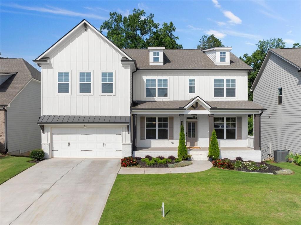 MOVE-IN READY 5BR/4BA home in sought-after Mundy Mill! This spacious 3,540 sqft home features an oversized primary suite with a custom California closet and spa-style bath with double walk-in shower, dual vanities, and bench seating. The gourmet kitchen includes granite countertops, double ovens, walk-in pantry, and upgraded luxury fixtures. Enjoy formal and casual dining spaces, plus an upstairs loft with double doors perfect for a home office or media room. Covered back porch with swing, custom mudroom, walk-in closets, and unfinished basement for storage. Washer, dryer, refrigerator, TVs included. OWNER/AGENT.