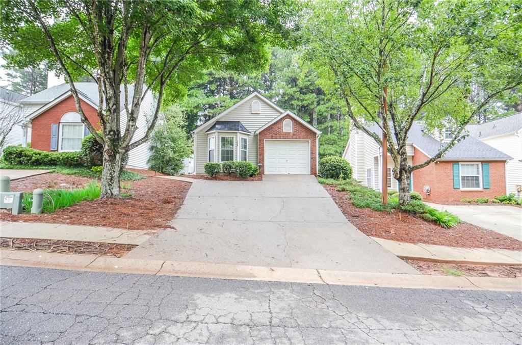 Welcome to 204 Chelsea Court, an adorable 2-bedroom, 2-bath home with a one-car garage, ideally situated just minutes from Kennesaw State University. A private side-entry front door invites you into a welcoming foyer that opens to a spacious, open-concept layout. The dining area flows seamlessly into the L-shaped living room, highlighted by vaulted ceilings, while the large U-shaped kitchen offers plenty of counter space for cooking and entertaining. The primary suite is a true retreat, complete with a charming bay window, a generous bathroom, and a large closet. The secondary bedroom and hall bath provide a perfect setup for a roommate or comfortable guest accommodations. The private garage comes pre-wired for an EV car charging station, adding modern convenience. Outside, the fenced backyard features a cozy patio—ideal for sipping your morning coffee or relaxing in the evenings. Located close to shopping, dining, and with quick access to major highways, this home combines charm, convenience, and opportunity. Plus, with an HOA that has no rental restrictions, it’s a fantastic investment opportunity for long-term rental, short-term rental, or personal use.