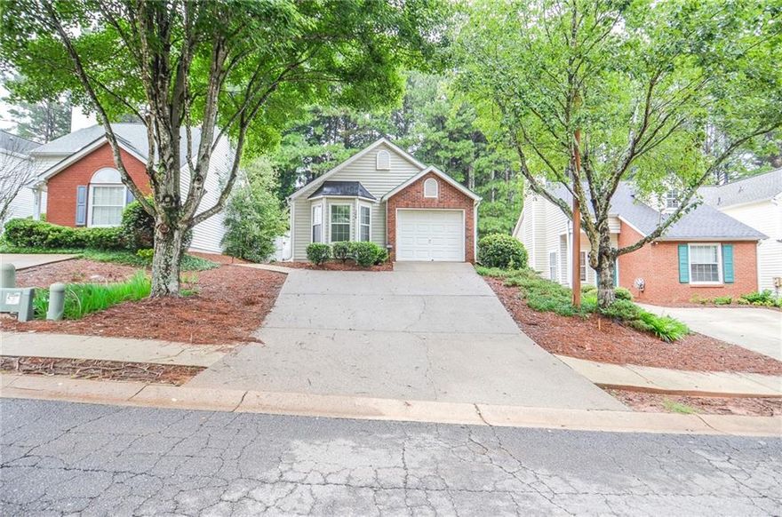 Welcome to 204 Chelsea Court, an adorable 2-bedroom, 2-bath home with a one-car garage, ideally situated just minutes from Kennesaw State University. A private side-entry front door invites you into a welcoming foyer that opens to a spacious, open-concept layout. The dining area flows seamlessly into the L-shaped living room, highlighted by vaulted ceilings, while the large U-shaped kitchen offers plenty of counter space for cooking and entertaining. The primary suite is a true retreat, complete with a charming bay window, a generous bathroom, and a large closet. The secondary bedroom and hall bath provide a perfect setup for a roommate or comfortable guest accommodations. The private garage comes pre-wired for an EV car charging station, adding modern convenience. Outside, the fenced backyard features a cozy patio—ideal for sipping your morning coffee or relaxing in the evenings. Located close to shopping, dining, and with quick access to major highways, this home combines charm, convenience, and opportunity. Plus, with an HOA that has no rental restrictions, it’s a fantastic investment opportunity for long-term rental, short-term rental, or personal use.