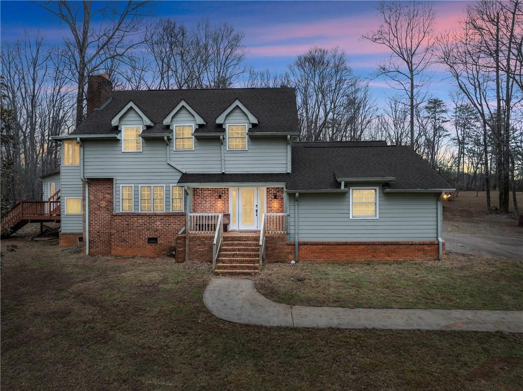 This traditional 4-bedroom, 3-bathroom home offers the perfect combination of space, comfort, nature and privacy on 9.6 +/- secluded acres. Featuring two potential master suites-one on the main level and one upstairs-it's ideal for flexible living arrangements. Enjoy peace of mind with a brand-new tankless water heater, upstairs HVAC, new garage door, and a newly paved driveway, along with all-new kitchen appliances and split HVAC systems throughout for year-round comfort. A detached bonus room provides a private office, guest space, or creative retreat, while the spacious garage offers ample storage and workspace potential.
Located directly across from Wolf Mountain Winery, just 10 minutes from Downtown Dahlonega and 4 miles from Lake Zwerner, this home combines rural serenity with easy access to local attractions.
**Listed under recent appraisal - instant equity at closing, Choice Home Warranty AND $1k Preferred Lender Credit Available with Brittany Evans, Nexa Mortgage on this home!!**
Don't miss your chance to own this peaceful North Georgia retreat.