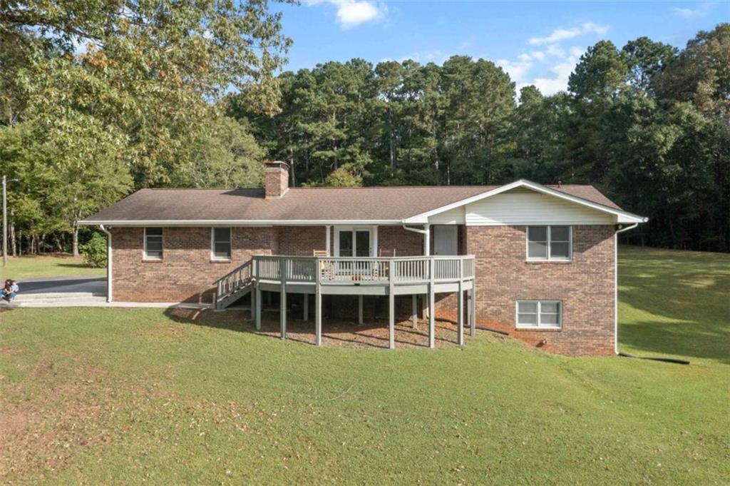 Your Dream Retreat Awaits - Brick Ranch on 24 Acres! Imagine waking up in a charming four-sided brick ranch surrounded by 24 acres of rolling woods and privacy. From the moment you pull up the paved driveway, you'll know this is more than just a home-it's a lifestyle. Step inside and enjoy fresh updates throughout: rich LVP flooring, modern lighting in every room, and a freshly painted interior that feels bright and inviting. The kitchen is both stylish and functional with hard surface counters and a gas stove, while the grand fireplace with gas logs makes the living area a cozy gathering spot. The primary suite is a true retreat with its handicap-accessible tiled walk-in shower as well as heated floors~ a thoughtful upgrade blending comfort and elegance. Love natural light? The sunroom is the perfect spot to sip morning coffee, read a book, or simply soak in the surrounding views year-round. But the magic doesn't stop upstairs. The full unfinished basement is already studded, plumbed, and wired-ready to become an in-law suite, rental, or ultimate entertainment space. With its own fireplace and private exterior entrance, the possibilities are endless. Outside, you'll love entertaining or relaxing on the front deck with mountain views or the back deck overlooking your wooded acreage. For the hobbyist or adventurer, the property includes a rustic barn housing the well pump with extra storage, an RV pole barn with additional parking, and an electric gate for added security. And with a whole-house generator, you'll always have peace of mind no matter the weather. When you're ready to explore beyond your land, you're just minutes from Rocky Mountain Recreation Area, offering hiking, fishing, and family fun. This is more than a home. It's privacy, potential, and pure beauty-all wrapped into one. Don't miss the chance to make it yours.