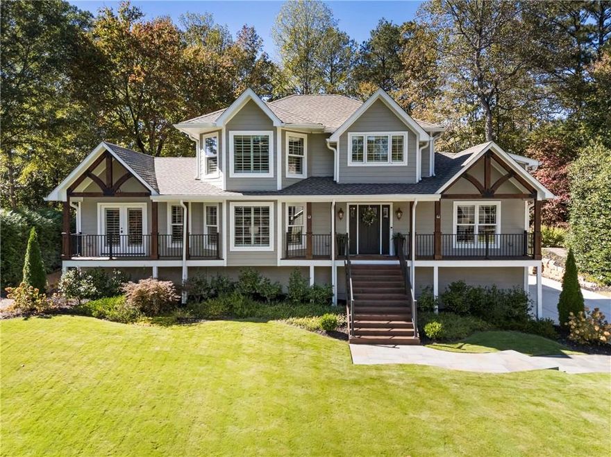 Welcome to Maple Lane, where serenity and sophistication meet the ultimate walkable Downtown Alpharetta lifestyle. Completely transformed in 2022 from a 1,800 sq ft cottage into an over 4,000 sq ft custom-designed showplace, this home blends refined design, functional luxury, and modern comfort, all on a private, level lot with a walkout saltwater pool. From the moment you arrive, the gas lantern–lit front porch invites you in. Inside, the bright foyer is flanked by a charming office with triple bay windows overlooking the manicured front lawn. Across the hall, the home opens to an expansive chef’s kitchen designed for both daily living and elegant entertaining. Kitchen highlights include: JennAir Professional appliances, including a 42” built-in French door fridge/freezer, 48” 6-burner gas cooktop w/griddle and custom designer vent hood, Double wall ovens, and double porcelain sink. Custom cabinetry offering detailed drawer inserts, a hidden walk-in pantry, a butler’s pantry w/beverage cooler, with abundant storage. The vaulted, beamed family room centers around a stone fireplace and custom mirrored built-ins, French doors open directly to the backyard for seamless indoor-outdoor living. The main level delivers ideal everyday functionality with a powder room for guests, a laundry room, and a primary retreat featuring vaulted ceilings, French doors to a covered private deck, a luxury spa bath with a custom clawfoot tub, a walk-in shower, double vanities, and a custom closet with built-ins. A separate sauna room offers the flexibility to serve as a second closet or wellness space. An additional main-level ensuite bedroom includes a custom closet and French doors leading to its own private porch. Upstairs, discover a jr primary suite with a spacious bath and walk-in closet, plus an additional bedroom with a full bath and a versatile loft area perfect for a playroom, office, or lounge. The finished terrace level features its own laundry hookup, kitchenette, full bath, exercise room, additional rooms/sitting area (walls could be opened up) for a future large rec or media space. The oversized 3-car garage provides plenty of space for vehicles, storage, or hobby use. Step outside to your private backyard oasis, complete with: Saltwater pool, Covered and uncovered deck spaces for entertaining, Turf play area, Custom fire pit for evenings under the stars, fully fenced yard perfect for pets and play. Additional features include whole-home water purification, spray foam insulation, and all new systems (2022) for turnkey peace of mind. Located in one of Downtown Alpharetta’s most desirable neighborhoods, this home offers unmatched walkability to restaurants, shops, farmers markets, live music, and festivals, everything that makes Alpharetta one of Georgia’s most vibrant communities. 3051 Maple Lane—where design, comfort, and location come together perfectly.