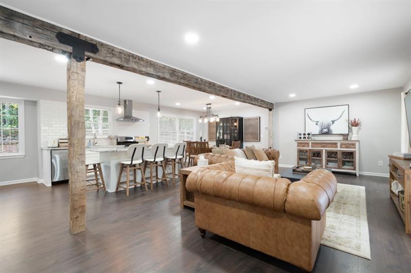 This impeccably renovated traditional home in the heart of East Cobb offers 4 bedrooms, flex room and 3 full baths. On just over half an acre this standout property perfectly blends comfort, style and outdoor living. Open concept floorplan features beautiful barnwood beams, seamless flow into the gourmet kitchen with oversized island, quartz countertops, white shaker cabinets, stainless gas range, breakfast bar, pantry and dining area overlooking the yard. The renovated baths include a primary ensuite, main bath with double vanity and modern finishes. The spacious primary bedroom also features a walk in closet with custom shelving. Three additional bedrooms and a bath are located on the upper floor. The flexible lower level bedroom w/full bath access is perfect for guests, cozy den or home office. The inground salt water pool with updated liner, expansive deck and a low maintenance yard is tailor made for summer gatherings. This amazing property is close to shopping, dining, park and the vibrant Marietta Square.
