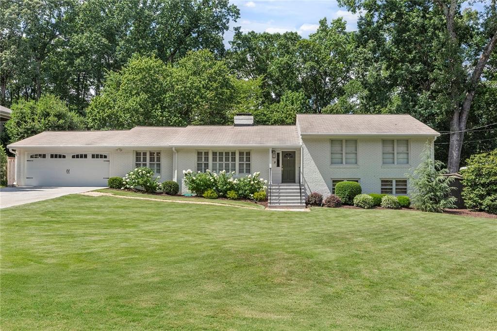 Nestled in the highly desirable High Point community, this move-in-ready, multi-level ranch-style gem offers a perfect blend of modern upgrades and timeless charm. As you step inside, you’re welcomed into a moody, warm library/formal living area that flows seamlessly into an elegant formal dining room perfect for hosting and comfortably seating twelve. This inviting front space sets the tone for the rest of the home, combining rich character with stylish functionality.
At the heart of the home is a beautifully renovated kitchen featuring crisp white cabinetry, quartz countertops, stainless steel appliances, and a gourmet gas cooktop and a built-in wet bar all overlooking the spacious family room. Just off the kitchen, step out onto a covered, screened-in porch — an ideal spot for relaxing or entertaining year-round. Gorgeous hardwood floors run throughout the open-concept main level, filled with natural light from oversized windows. Vaulted ceilings and a cozy fireplace add warmth and sophistication to the family room. The generously sized primary suite, along with versatile guest bedrooms, offers plenty of space for family, visitors, or a home office — all complemented by tastefully updated bathrooms. The partially finished lower level features a spacious open living area with direct access to the backyard, a full bathroom, and additional unfinished storage space — ideal for a gym, workshop, or future expansion.
Outside, enjoy a beautifully landscaped flat lawn, a fire pit gathering area, and expansive patio space perfect for unforgettable outdoor moments.
Located just minutes from shopping, dining, parks, trails, and major highways, this home offers the ideal balance of comfort, style, and convenience.
This thoughtfully updated home is a rare find in High Point, offering the perfect blend of style, function, and location — it truly checks all the boxes.