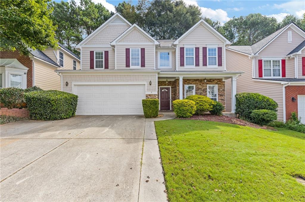 Welcome to this stunning open-concept home in a highly desired swim community. This home perfectly blends style and functionality, As you step inside, you'll love the spacious and airy feel of the home. This beautiful 4-bedroom, 2 1/2 bath layout is perfect for hosting gatherings of any size, allowing for a natural flow between the areas. The chef's kitchen has tons of cabinetry, Silestone counters and ample counter space. The large primary suite is a true sanctuary designed for ultimate comfort. Upstairs, you'll find 3 additional bedrooms and a large, cozy loft that adds an extra dimension to the home, providing a flexible space that can be used as a home office, reading nook, or additional living area. The previous owner built the enormous back deck but it can be taken down is a flat backyard is desired. Location is key, and this home delivers on convenience. Situated close to Jimmy Carter Blvd, you'll have easy access to a variety of shopping centers, dining options, and entertainment. The area is rich with amenities, ensuring that everything you need is just a short drive away. Also, the home is located in a highly regarded school district, making it an excellent choice for families seeking quality education for their children.