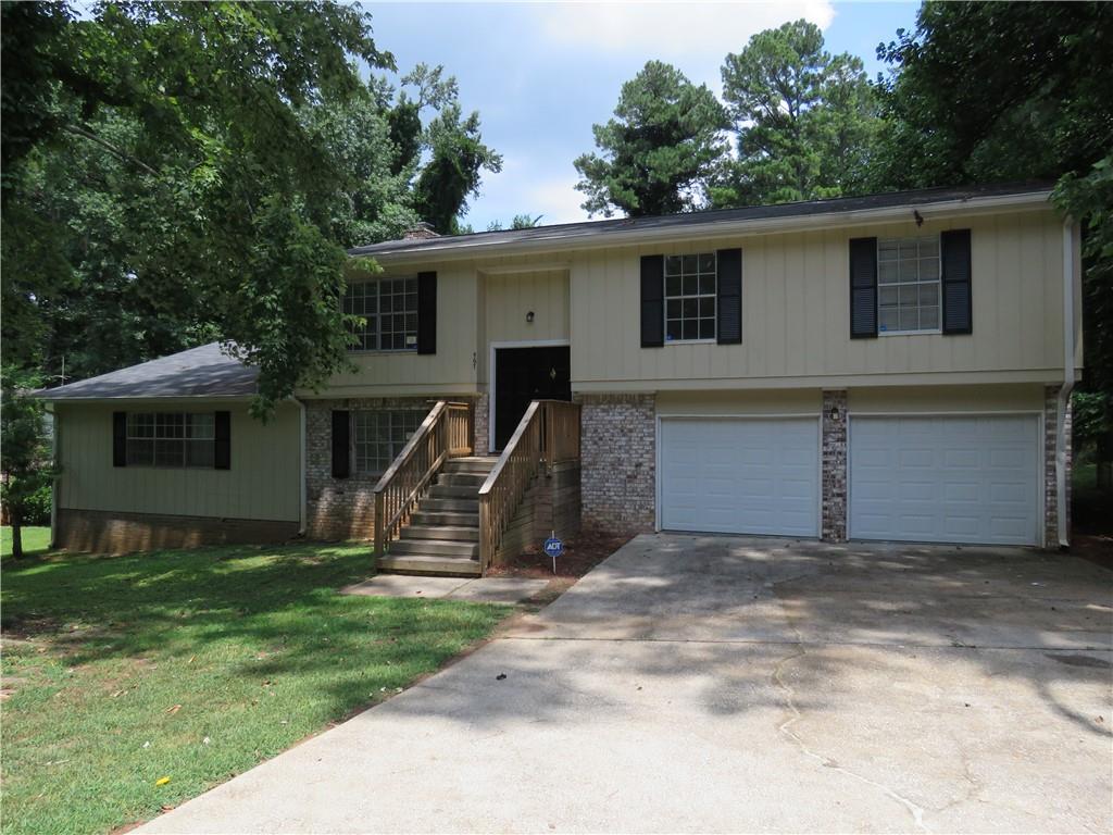 Opportunity Knocking - Expansive Home with and Additional Large Lower Level 1 Bedroom / 1 Bath Living Suite with Living Room Area, Family Room Area with Fireplace . Exciting Brick & T-111 Sided Split Foyer with Newer Paint - Total 4 bedroom, 3.5 Bath Home with Character and Charm. Light, Bright and Open Describes This Well Designed Floor Plan that Flows. Ideal For Generational Living. Open Spacious Foyer Greets Your Guests. Entertainment Size Living Room for Hours of Quality Time. Open Dining Room to Expand Your Seating For Guests. Spacious Culinary Kitchen To Hon Your Cooking Skills with Large Island Area. Easy Spacious Nice Size Bedrooms with Two Hall Baths Upstairs. Half Bath Lower Level. Large Pull Down Attic To Store More Than You Can Believe. Fabulous .93 Acre Lot Large Size Fenced Yard. House with Great Utility and Potential. Located in the Convenient Sought After Stone Mountain, Ga. with Easy Access to Everywhere. Location with Close Proximity to Support Services, Major Roads, Education Facilities and Medical Facilities. The Seller Has Never Occupied Subject, It Was Used Prior as a Rental Property. This Home is Being Sold " As Is", Where Is With No Disclosures. Buyers Will Have the Right to an Inspection. On Septic. Selling Agents See HOA for All Details If One Exists. The "Closing" Shall Not Occur Within 21 Days of Effective Binding Date. Seller Needs Time to Coordinate Title and Closing. Home Will Need Some Attention to Details. Inspect, Compare and Price for Area!