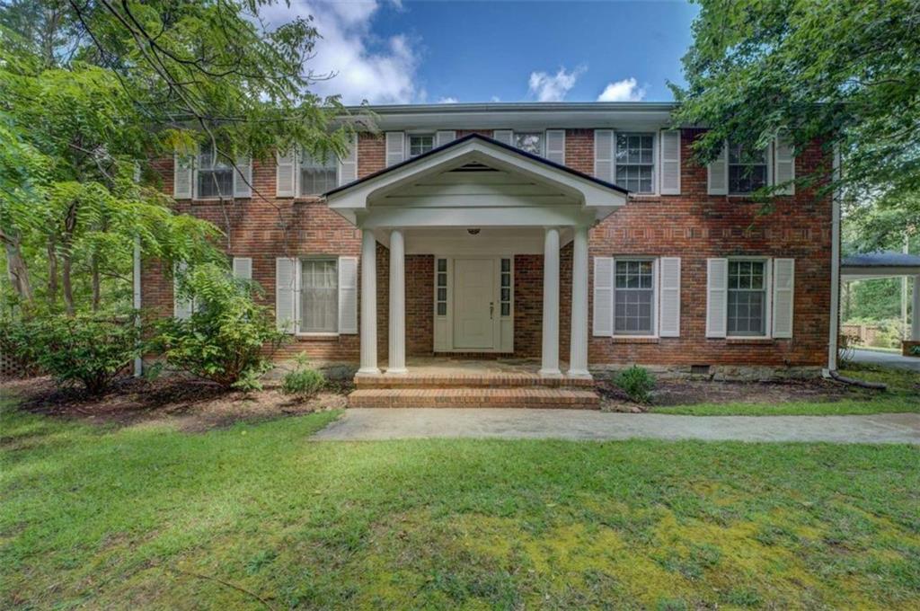 ** HUGE 4 BEDROOM 3 1/2 BATH HOME WITH AN ADDITIONAL DUPLEX WITH EACH UNIT HAVING 2 BEDROOM 1 BATH ON PROPERY**MAIN HOUSE IS HUGE 2 STORY 4 SIDED TRADITIONAL BRICK TRADITIONAL CUSTOM BUILT HOME WITH 3356 SQ FT - FOYER ENTRACE WITH GORGEOUS STAIRCASE -MAIN FLOOR FEATURES FORMAL LIVING ROOM, FORMAL DINING ROOM, HUGE FAMILY ROOM WITH FIREPLACE WHICH IS OPEN TO KITCHEN WITH TONS OF CABINETS AND COUNTERSPACE - LAUNDRY ROOM WITH 1/2 BATH AND MUD SINK - HUGE MASTER BEDROOM AND BATH - UPSTAIRS YOU WILL FIND 3 LARGE BEDROOMS, 2 FULL BATHS AND A OFFICE/STUDY WITH CLOSETS AS WELL - ROCKING CHAIR FRONT PORCH, ADDITIONAL SCREENED IN PORCH WITH COVERED PARKING - TWO CAR CARPORT - GORGEOUS YARDS WITH TONS OF SPACE FOR GARDENS. TWO OUTBUILDINGS - HOME JUST NEEDS UPDATING - BRICK DUPLEX WITH EACH HAVING 2 BEDROOMS 1 BATH, LIVING ROOM AND EAT IN KITCHEN - MAIN HOME DOES HAVE ANOTHER DRIVEWAY THAT COULD BE EASILY ACCESS OFF OF KIRKUS DR IF YOU WANTED TO SEPARATE TOTALLY FROM DUPLEX - CONVIENENTLY LOCATED CLOSE TO SHOPPING, INTERSTATE, RESTAURANTS AND SCHOOLS