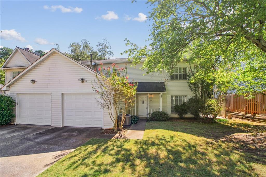 Sweet Condo in Dover Place Norcross with brand new remodeled bathroom! 2 Bedrooms, 1 and 1/2 bathrooms. Large 1-car garage with roll up door. Huge living room with kitchen island. Perfect kitchen with pantry storage, and plenty of cabinets, tile backsplash and gas range for cooking.