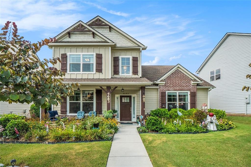 Charming well-maintained Cottage-style home with a welcoming two-story foyer that flows into a spacious, light-filled living room. The main level features a formal dining room with elegant coffered ceilings, a gourmet kitchen with custom cabinetry, an oversized island, granite countertops, tile backsplash, and double ovens—perfect for entertaining. You'll also find a convenient laundry room and the luxurious owner's suite on the main floor. The primary bath includes a soaking tub, separate shower, dual vanities, and a generous walk-in closet. Upstairs, enjoy two additional bedrooms and a versatile loft area. Gorgeous landscaping creates peaceful living. This low-maintenance, main-level living home is nestled in the heart of Powder Springs, just minutes from shopping, dining, and recreation.
