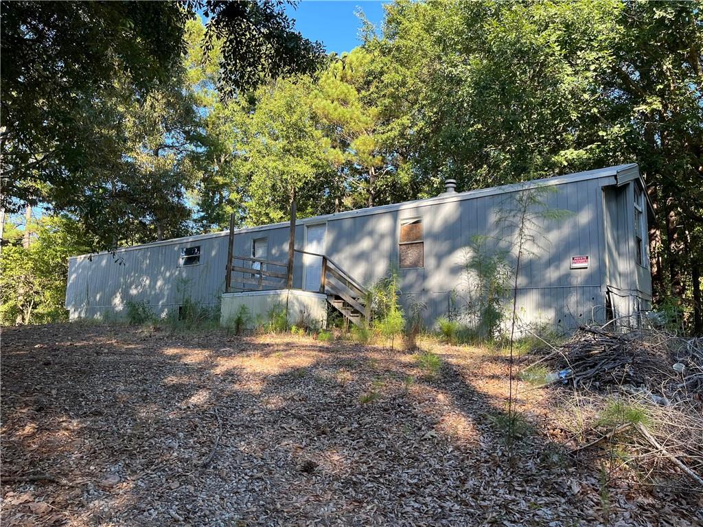 Investment Opportunity – Anderson Acres Manufactured Home Park
Just 10 minutes from Covington Square, this lot in the Anderson Acres community offers two manufactured homes. The back home has had some renovations but still requires TLC, while the front home will need repairs or replacement. The seller also has an additional lot available (320 First St.) with a double-wide and single-wide home, but they are willing to sell it individually. Sold AS-IS. Cash only – a great opportunity for investors!