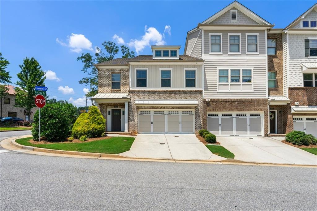 Located in the highly rated Wheeler High School district and just 5 minutes from I-75, this elegant 3-bedroom, 3.5-bath townhome offers 2,511 sqft of upgraded living in one of Marietta's most desirable communities. This former model home is positioned right at the community entrance and shines with premium touches throughout - from the south-facing natural light and open floor plan to hardwood floors and a cozy electric fireplace. The kitchen features Whirlpool appliances, a gas cooktop, and generous space for entertaining. The primary suite is a true retreat with a private deck, soaking tub, separate shower, double vanity, and two walk-in closets plus a linen closet. Each bedroom includes its own en-suite bathroom, and the laundry is conveniently located on the master level. Additional standout features include: **Double car garage with epoxy floors **Insulated garage doors **Gas heating for HVAC and water **Pre-wired for security **Semi-private backyard HOA covers roof, termite protection and exterior maintenance With modern finishes, thoughtful upgrades, and an unbeatable location near top schools and major highways, this move-in-ready home blends comfort, convenience, and accessibility. Schedule your private tour today!