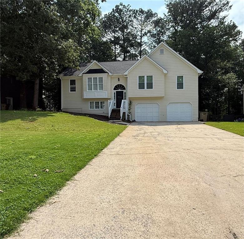 If you are looking for a beautiful home to rent in Woodstock. This is definitely your best option! A wonderful home with 3 bedrooms / 2 full bathrooms in the main level with a finished lower level basement. Open concept living area, nice kitchen with freshly painted white cabinets and stone countertops. The spacious open concept living-dining room features vaulted ceilings and abundant natural light, offering a warm and inviting atmosphere for relaxing or entertaining family and friends. Laundry closet with washer and dryer included as a landlords courtesy. Freshly painted interior and exterior. The fully finished lower level offers a versatile family room and flex space, providing additional room for recreation, hobbies, or a home office, including a small space with sound panels for music, podcast/content development, sensory room or even a closet to add a 4th bedroom! Outside, you'll find a large deck overlooking the fully fenced-in backyard, ideal for the entertaining of the whole family. Wonderful neighborhood, Very Convenient and Close to hwy 575, shoppings and restaurants. Don't miss out on this fantastic opportunity to lease makethis beautiful house Come and lease it.