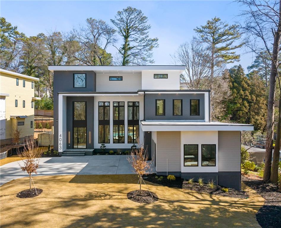 A rare opportunity for unique and modern luxury arrives in Buckhead by WilliamMarkDesigns. This custom new construction home will come with all the bells and whistles. Upon entering the home the 9 foot tall steel door reveals an open three story entryway and stairway featuring a stunning 3 story, 30 pendant chandelier, hardwood floors, and abundant light shining through a stunning window package from floor-to-ceiling. Custom European flat panel cabinetry, subzero/wolf appliances and quartzite countertops highlight a breathtaking kitchen in addition to a private scullery, and endless pantry space. All the little details prevail throughout with a massive master suite containing separate floating vanities, custom oversized closet with a center island, and a sitting area with balcony overlooking the pool. The main floor also contains a 2 story living room with an oversized dining room as well. All bathrooms include floor-to-ceiling tile as well bringing a true sense of elevated craftsmanship from the developer. A carefully thought out 3rd level featuring a private rooftop terrace and separate indoor/outdoor kitchenettes to enjoy a glass of wine or host your closest friends. The property is pre-wired at every corner including all windows for future custom shades or blinds, and even includes an elevator to all 3 levels. The flat back yard comes with plenty of space and beautiful custom pool and hot tub. This is the location and oasis you’ve been waiting for in 2025.