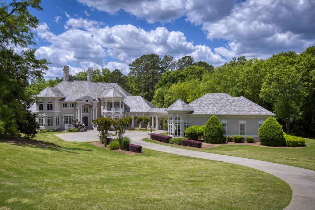 Your Renovated Fortress custom built by well known & loved Dick Clegg with Housing Trends awaits! A calming main level owners retreat & Luxury Spa Bath that is all as warm, as it is inviting, this architectural treat answers all of the new needs of our current lifestyles. Entertaining spaces, private stunning useable acreage built on two separate deeded and recorded building lots with so much to enjoy; you will never want to leave! Five bedrooms in the main house, all EnSuite , with countless bonus areas and a private detached walk in level 2 bedroom & 2 bath Guest House w/2car garage! Renovations include a beautifully designed limestone & marble Chef's Kitchen open to an enormous & inviting fireside Family Room with views breathtaking views overlooking the Pebble Tec & salt water pool & cabana as well as a tennis court & covered pavilion. The terrace level features a media room, home gym, & a large entertaining area. A completely private property in an intimate non-amenity exclusive gated community where your family & guests are welcomed with open arms, activities & exquisite landscaping. Retreat to this poised & scaled masterpiece built for both your working & entertaining lifestyle. Top schools, prime John's Creek location. Minutes to 3 parks, shopping, medical, grocery & fine dining. Truly luxury living awaiting for your arrival!