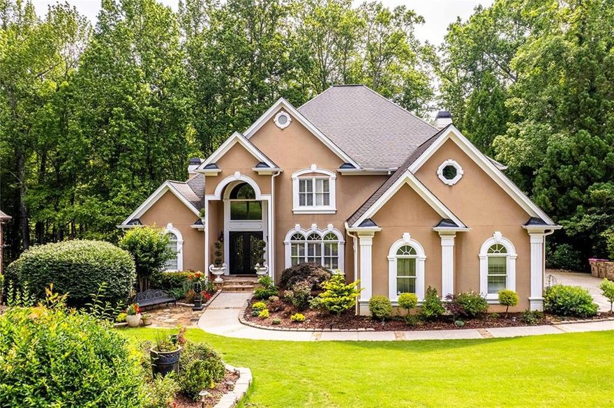 Presenting an exquisite new listing nestled in the prestigious Crooked Creek community! This remarkable residence has been meticulously updated, offering a harmonious blend of luxury and comfort, ready for you to enjoy. Situated on a tranquil cul-de-sac, the home boasts a private and serene backyard with enchanting creek and 18th fairway views. Expansive windows throughout the house bathe the interiors in natural light, accentuating the breathtaking vistas. The home features an array of desirable attributes, including a three-car garage, a grand two-story foyer and family room, an open floor plan, and a primary suite conveniently located on the main level. High-end finishes and beautiful tile floors add to the allure, while the expansive basement—with its high ceilings, numerous windows, secondary kitchen, theater room, bar, and hot tub room—makes it an entertainer's paradise. The esteemed Crooked Creek community offers unparalleled amenities, including golf, tennis, and swimming facilities, while its gated access with a security guard ensures peace of mind and privacy. With its prime location close to Milton, downtown Alpharetta, and top-rated schools, this property is truly a gem waiting to be discovered. Don't miss the opportunity to experience this magnificent home firsthand!