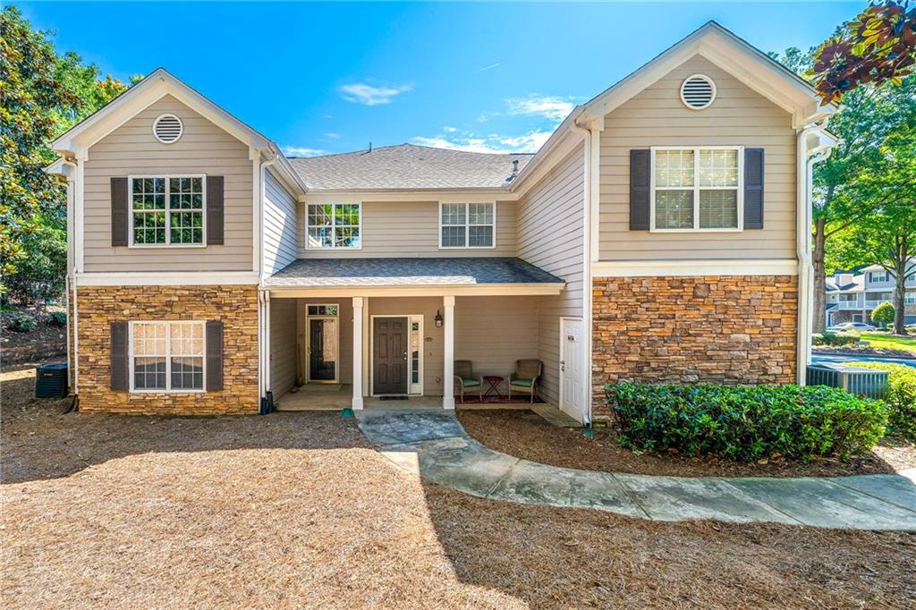 Remodeled 2 bedroom/2 bath condo in the Towne Lake Area. Condo is Close to popular Downtown Woodstock with multiple restaurants, shops, outdoor amphitheater, walking trails and more! Walk to Movie theater, shopping and dining. Home features newly painted interior. Kitchen is open to dining and family room. Family Room features Vaulted ceilings and cozy fireplace and opens to a covered back deck. Room mate floor plan. Updated Master bath with granite counters and walk in shower. Separate laundry off the kitchen. End unit with extra space in garage.
