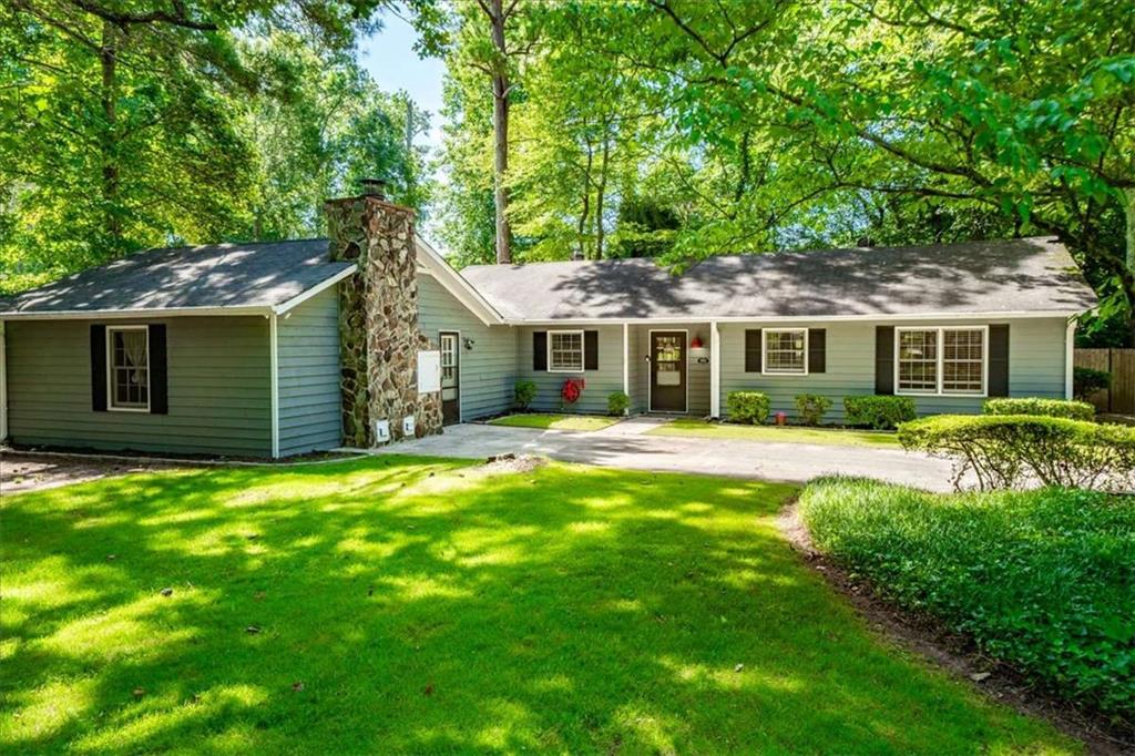 Welcome to The Cottage! This charming 4-bedroom, 3-bath ranch home is ideally located in the Roswell/East Cobb area. Situated in an award-winning school district in a sun-dappled neighborhood, 4361 Old Mabry Ln sits on a corner/cul-de-sac lot spanning over half an acre. It's conveniently close to shops, restaurants, parks, Downtown Roswell, Downtown Woodstock, and all the top sites in Marietta. The home has been well-maintained, featuring a renovated master bathroom, LVT flooring, two fireplaces, a fenced back yard, and plenty of natural light throughout the house.