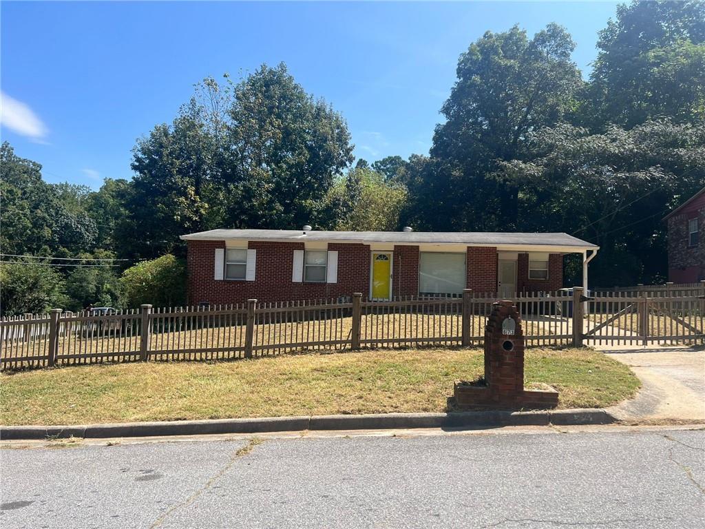 Charming 4-Sided Brick Ranch on Corner Lot. This 3-bedroom, 1.5-bath home sits in an established neighborhood and offers an open kitchen with a sitting area, hardwood floors, and a spacious fenced backyard. Recent improvements include new flooring, fresh interior paint, updated appliances, and a custom-built laundry closet for the washer, dryer, and water heater. Additional upgrades include a full perimeter fence, making this home move-in ready. Conveniently located within minutes of I-20 and I-285, with easy access to the Airport. The exploding Westside Beltline Trail, Ponce City Market, Atlantic Station, and Lee+White mixed-use entertainment complexes are a short drive away—offering endless dining and entertainment options.