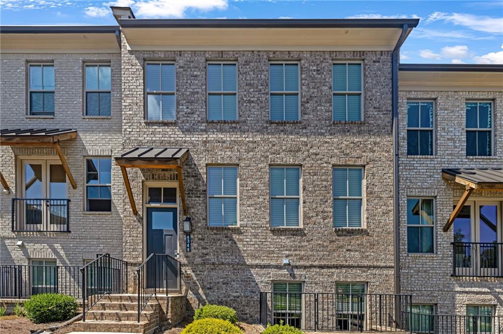 Welcome to this exquisite 4BR/3.5BA townhome in the sought-after Carver Hills luxury community! Located in Doraville with access to the highly regarded Dunwoody school district, this spacious home boasts the largest 4-bedroom floor plan in the community. Enjoy an open-concept layout featuring a stunning marble accent wall with an electric fireplace, hardwood floors, crown molding, and abundant natural light. The gourmet kitchen is a chef’s dream with quartz countertops, an oversized island, 42” cabinetry, stainless steel appliances, walk-in pantry, and French door access to the deck. The primary suite offers tray ceilings, a spa-like bath with a frameless glass shower, double vanity, and a walk-in closet with custom buildouts. A lower-level bedroom with full bath serves perfectly as a guest or in-law suite.
Carver Hills offers resort-style amenities including a saltwater pool, clubhouse, cabanas, fire pits, dog park, playground, walking trails, and gated security. Ideally located with immediate access to I-285 & Peachtree Industrial, plus just minutes to trendy eateries, greenspace, shopping, and the vibrant Doraville town center. This is luxury living at its finest with true live/work/play convenience!