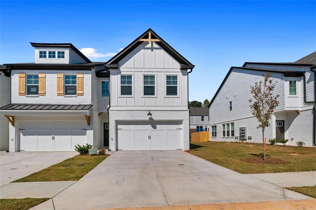 One of the MOST BEAUTIFUL Open Modern End Unit in Sought-after TOWNS OF AUBURN Community.... Also, the largest floor plans. Open floor plan, NAVY BLUE Cabinetry with white quartz counters, center island, breakfast area and grand family room w/fireplace, Solid Hardwood floors on main. Gorgeous master suite with walk-in closet, large secondary bedrooms, Upper level laundry room w/Washer and Dryer. Leveled fenced back yard is great for entertainment. This neighborhood has great amenities including tennis courts, pickleball, playground, fantastic pool, and clubhouse. Easy Access to 316.