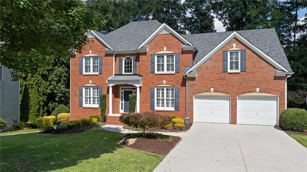 Welcome to 1224 Kenway Circle, a beautiful red-brick traditional home nestled in one of Smyrna’s most vibrant and family-friendly neighborhoods, King Valley. From the moment you arrive, the charming curb appeal and classic brick elevation set the tone for what’s inside. Step through the grand two-story foyer and feel the warmth of hardwood floors that flow across the main level, leading you to a formal dining room perfect for hosting holiday dinners or birthday celebrations, with sunlight streaming through a big front-facing window. Across the hall, a thoughtfully designed flex room, now a dedicated home office with French doors, makes working from home both productive and peaceful. And with ATT Fiber internet already installed, you’ll enjoy fast, reliable connectivity—ideal for remote work and virtual meetings . The spacious living room is the heart of the home, anchored by a cozy fireplace, just waiting for movie nights, game days, or quiet evenings in. The kitchen is a total showstopper, recently remodeled with custom ceiling-height cabinetry, soft-close drawers, stainless steel appliances, a sleek backsplash, and an oversized island ready for baking cookies with the kids or wine and charcuterie with friends. Step outside to your private deck and imagine summer BBQs, birthday parties, and starlit conversations while the kids run wild in the fenced backyard. Upstairs, retreat to your luxurious primary suite with hardwood floors, tray ceilings, and a wall of windows flooding the space with light. The remodeled spa-like bath and large walk-in closet make it a true escape. With four more spacious bedrooms upstairs, there's plenty of room to grow, host guests, or create that dream playroom or craft space. The finished basement is the ultimate bonus, already complete with a full bath and wide-open space that’s perfect for a home theater, gym, bar, game room, or kid’s paradise. This is a home that grows with you. The neighborhood is brimming with amenities including a clubhouse, pool, tennis courts, and walkability to King Springs Elementary. It’s full of energy with year-round events, creating a strong sense of community where neighbors quickly become friends. And the location is unbeatable, just minutes from Smyrna Market Village with boutique shopping, local wine tastings, a brewery, and great dining. Outdoor lovers will appreciate being five minutes from the Silver Comet Trail, and if you're a Braves fan or just love a great night out, you’re only 15 minutes from The Battery Atlanta. ***Make this deal greater by using our prefered lender Mortgage Atlanta and receiving $4000 towards your Closing Cost***