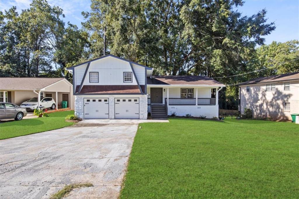 Fully renovated and move-in ready, this Decatur beauty combines modern upgrades with versatile living. Featuring 4 spacious bedrooms and 2.5 updated baths, this home offers room for everyone to spread out. The open-concept home boasts new LVP flooring, new carpet, new water heater new blinds and fresh interior and exterior paint. At the heart of the home, the kitchen is a showstopper, complete with an oversized island, new sleek white cabinetry, quartz countertops, a designer backsplash, recessed lighting and brand-new stainless-steel appliances. This home features a second living room which creates the perfect hangout spot for entertaining. Each bathroom has been stylishly renovated with new tile & modern finishes. The additional basement level offers flexible space for a game room, home office, gym, or creative studio. Step outside to enjoy the large deck overlooking the fully fenced backyard, ideal for pets, gardening, or future outdoor living upgrades. An attached garage provides convenient parking and storage. With its clean design, multiple living areas, and prime Decatur location, this home delivers both style and functionality. Come see this beauty today!