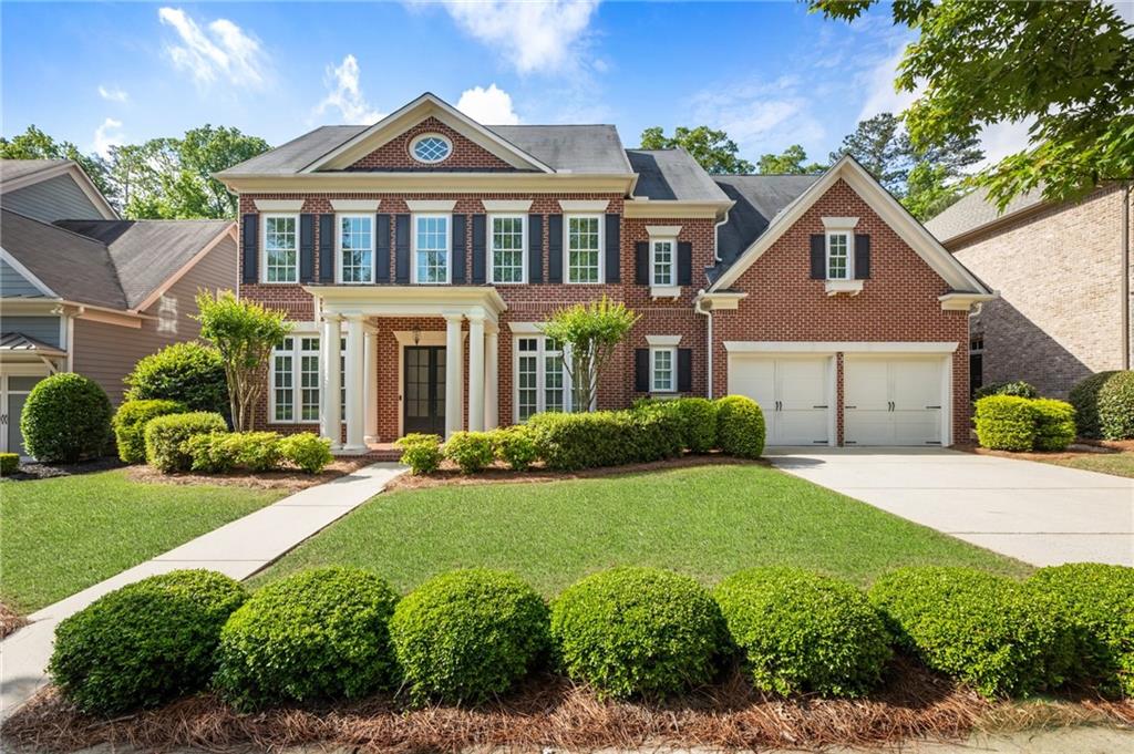 VILLAGE VIBES + LUXURY LIVING
With golf-cart proximity to award-winning schools, boutique shopping and local favorites, this five-bedroom, four-bathroom home pairs effortless livability with the charm of Milton’s vibrant village atmosphere. Tucked inside the sought-after John Wielund neighborhood of Braeburn, it is move-in ready and made for memory-making. Relish the proximity to Northwestern Middle School and Milton High School, Six Bridges Crabapple and community events in Downtown Milton and Crabapple. Relax in the flat, fenced backyard with a firepit and a water feature, along with a covered flagstone patio perfect for enjoying peaceful moments, lively get-togethers and everything in between.
Inside, discover airy interiors painted in Alabaster White. The main level commences with a gracious entry and dining area enhanced by stylish trim and hardwood floors. Overlooking the light-filled family room and backyard retreat, the chef’s kitchen impresses with quartz countertops and backsplash, stainless steel appliances, a center island and ample cabinet storage. Guests will appreciate the comfort and privacy of the main-level suite, featuring abundant natural light and a full en suite bathroom.
Upstairs, retreat to a spacious owner’s suite with a sitting room and an en suite bathroom featuring dual vanities, a soaking tub and a separate walk-in shower. Three additional bedrooms and two full bathrooms provide ample space for guests, family, or flexible living arrangements. Don’t miss the full, unfinished third floor, offering endless potential for any lifestyle ... options include a dream media room, a home gym, a hobby space or a yoga studio. Enjoy the spacious two-car garage with a level driveway and kitchen-level entry—it makes unloading groceries effortless. Finally, this vibrant community offers amenities for all ages, including a pool, a clubhouse, a fitness center, and nearby parks and green spaces. Welcome to 2165 McFarlin Lane.