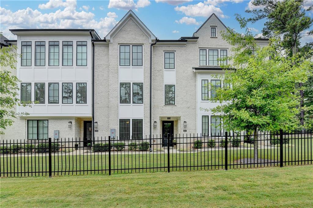 Welcome to this stunning modern white brick townhome in the heart of Sandy Springs! Offering three
levels of beautifully designed living space, this home features elegant LVP flooring, a neutral color
palette, and stylish updated lighting throughout.
As you enter on the lower level, you'll find a private bedroom and full bathroom—perfect for guests or a
home office—along with convenient garage access and a charming staircase leading to the main living
area.
The spacious open-concept kitchen is a true highlight, boasting sleek gray cabinetry, quartz
countertops, a large island, ample storage, a generous dining area, and a walk-in pantry. Flooded with
natural light thanks to large windows, the inviting family room offers built-in bookcases and direct
access to a sunny deck—ideal for relaxing or entertaining. A modern half bathroom completes the main
level.
Upstairs, unwind in your luxurious owner’s retreat, featuring a spa-inspired ensuite bathroom with an
expansive walk-in shower, double vanities, and a spacious closet. You’ll also find two additional
bedrooms, a full hall bath, and a convenient laundry room on this level.
Nestled in a prime location with quick access to Georgia 400, shopping, and a variety of top-rated
restaurants, this townhome combines comfort, style, and unbeatable convenience.