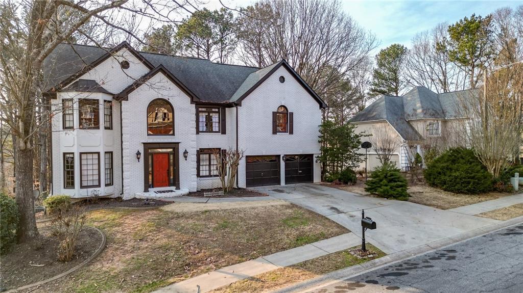Incentives Galore!! Com take a look. Beautiful home in sought after Fariways at Towne Lake. This home features a Chef's kitchen, 5 burner cooktop with griddle, double ovens, granite counters, tiled backsplash, wine rack & under cabinet lighting. Eat in breakfast area. Hardwood floors throughout the main floor. Formal living room & Separate dining room that fits 10+ easily. Family room is grand with cathedral ceilings & a fireplace w/built in book cases. Wrought iron spindles, upgraded light fixtures. Upstairs consist of Oversized master bedroom with sitting room. Master spa features Italian tiled floors and shower, granite tops and designer sinks w/ double vanities. 3 spacious secondary bedrooms. In law suite in the finished basement with kitchenette. Basement has additional family room with a fireplace. Huge covered screened in porch, fenced in yard, and much more!! Close to shopping, schools, & parks. Need some help with updates? Seller is willing to contribute.