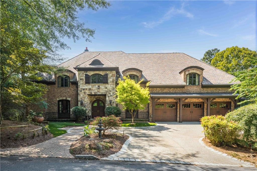 Private French Country Estate in Prime Location! Discover timeless elegance in this exquisite 6-bedroom, 7 full baths, 3 half baths French Country Estate designed for luxury living and grand entertaining. Two Primary Suites, seven fireplaces, and four laundry rooms offer unparalleled convenience and comfort.
Perfect for multi-generational living, the home features 2 full kitchens, 2 kitchenettes, and 2 complete basement apartments—each with their own kitchen, laundry, and dining space. The main floor Primary Suite is a true sanctuary, featuring a spa-inspired bath with a black marble double shower, jetted soaking tub, vaulted ceiling, heated towel warmer, marble floors, double vanities, and in-suite laundry. The adjoining walk-in closet is custom designed with built-in shelving offering organization and elegance. The second-floor Primary Suite offers a grand retreat with a spacious bedroom, private sitting room, and a Juliet balcony overlooking the pool and wooded backyard. Its luxurious spa-like ensuite bath creates the perfect setting for relaxation and renewal.A soundproof theater room, pet shower, cabana apartment by the pool and Jacuzzi spa make this estate a true retreat.
Car enthusiasts will love the parking for 16 cars across two garages. Thoughtfully built with a tile slate roof, mahogany doors and windows, stone foundation, gas lanterns, open-cell foam insulation, central vacuum system, and full gas generator, this home combines beauty with lasting quality.
Inside, a curved custom staircase sets the tone for elegant living. The gourmet kitchen is a chef’s dream with a Wolf range and double oven, Wolf warming drawers, Sub-Zero refrigerator, built-in Gaggenau steamer, and Miele coffee system, crowned with a stunning stone hood.
Enjoy privacy on a 1-acre wooded lot with serene views, yet close to all conveniences.
This estate is more than a home—it’s a lifestyle.