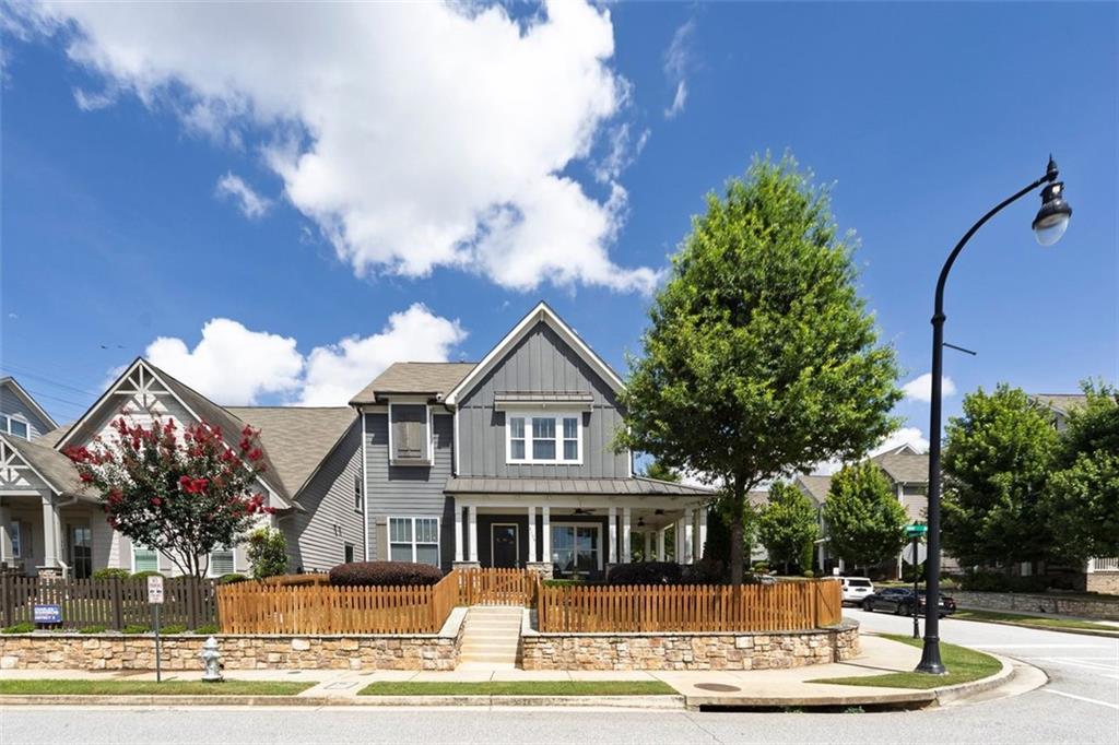 Welcome to 2108 Drew Drive in Atlanta’s sought-after West Highlands community. Charm, comfort, and convenience come together in this beautifully maintained Craftsman style home. The inviting wrap-around porch is a perfect spot to relax in the shade or read a book on the porch swing. Stepping into the home, you’ll be greeted by an open floor plan, beautiful hardwood floors, and abundant natural light throughout. The modern kitchen boasts marble countertops, stainless steel appliances, ample cabinet space, and a spacious pantry. A charming breakfast nook offers both comfort and practical everyday living. A large center island is perfect for additional prep space and gathering in a casual setting. The kitchen is open to the living room, providing space for relaxing in front of the gas fireplace or entertaining with friends. On the 2nd level, the generously sized primary suite is bright with natural light. The en-suite bathroom provides a spa-like experience with marble tile, double vanity, soaking tub, and all-glass walk-in shower. The spacious closet is equipped with an organized closet system, perfect for all of your clothes, shoes, and accessories. The 2 additional bedrooms share a full bath, accessible from each bedroom. The laundry room is also located on this level of the home, providing ease and accessibility. The third level has been renovated and is perfect for a fourth bedroom, private office, gym, home theater, or flex space to fit your needs. The space includes a full bathroom and unfinished area for your storage needs. Enjoy outdoor living on this sought-after corner lot with a private, fenced front and side yard and a charming porch. Oversized garage has plenty of space for 2 SUVs and also houses the tankless water heater. Tucked into a friendly, sidewalk-lined neighborhood with resort style amenities, it’s just minutes from Westside Park, Proctor Creek Greenway path, Bellwood Quarry Westside Park, Westside Beltline Connector, and vibrant local shops and eateries. Easy access to Midtown, Buckhead, and downtown Atlanta. Whether you’re a first-time buyer, a growing family, or simply looking for a move-in-ready gem near the heart of the city, 2108 Drew Drive is the one you’ve been waiting for!